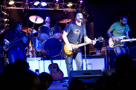 A band performing a gig on stage
