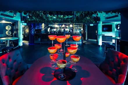 Cocktail party setup with bar and mood lighting at Embankment