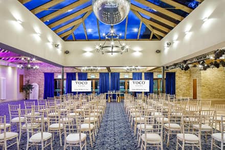 Conference space theatre style with screen at a voco hotel