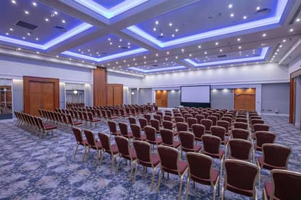 Conference room setup theatre style with screen at Chesford Grange