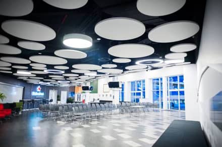 Modern conference space with theatre seating and screen