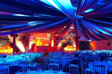 A function room setup for an awards ceremony with gala dinner