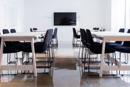 Training room setup with tables and screen