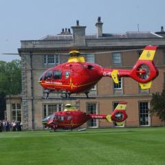 Helicopters landing in grounds Photo