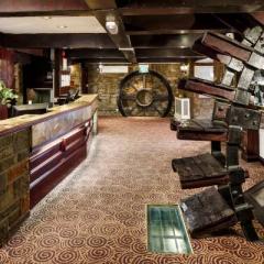 Reception Desk and Water Wheel at Mercure Perth Photo