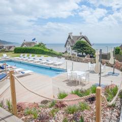 Outdoor pool, decking and views over Lyme Bay Photo
