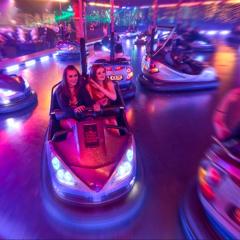 Guests riding on the dodgems Photo