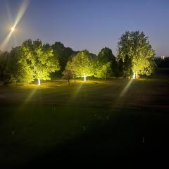 Golf course illuminated at night Photo